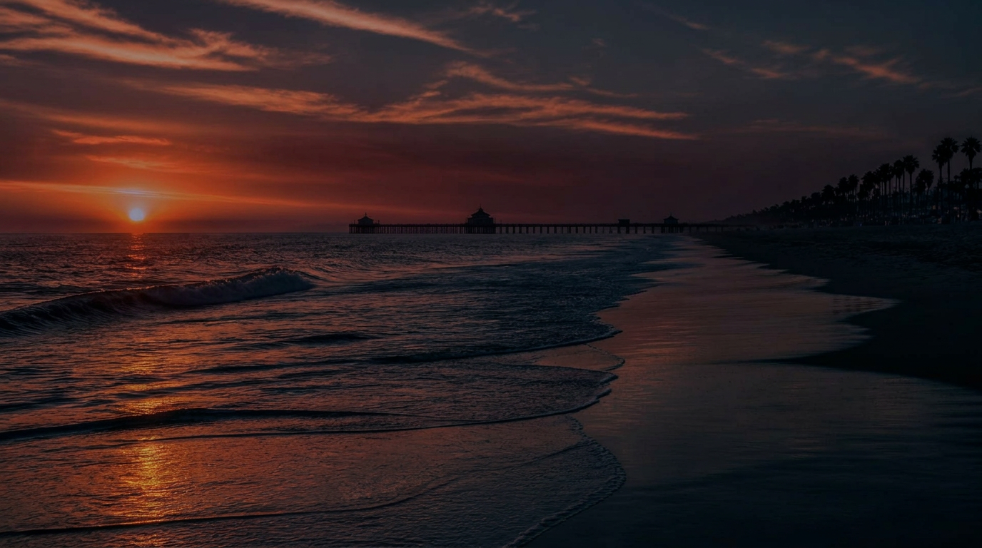 Orange County beach sunset with pier and palm trees